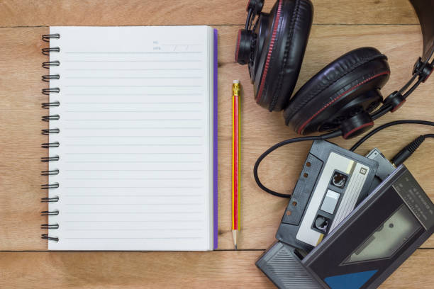 Desk with notebook, pencil and ipod