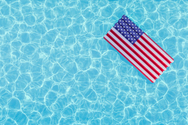Summer Relaxation On a Float American Flag stock photo