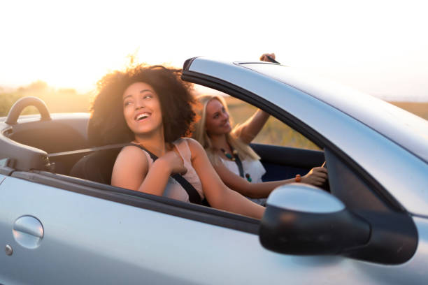 istock Girls traveling with car 821860448