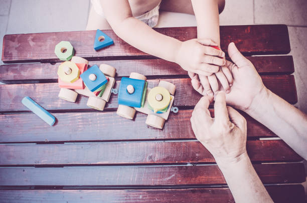 istock Children and mom's hands playing together 821860510