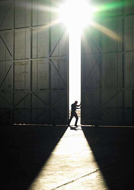 man pushing door open  aerospace industry stock pictures, royalty-free photos & images