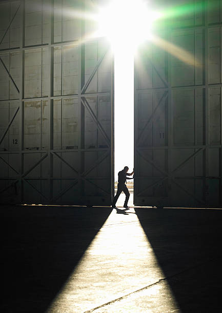 man pushing door open  open stock pictures, royalty-free photos & images