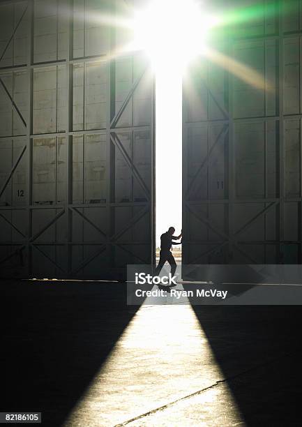 Man Pushing Door Open Stock Photo - Download Image Now - Door, Opening, Opportunity