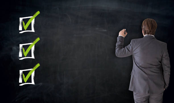 istock Businessman writing with checkbox concept on blackboard 821862282