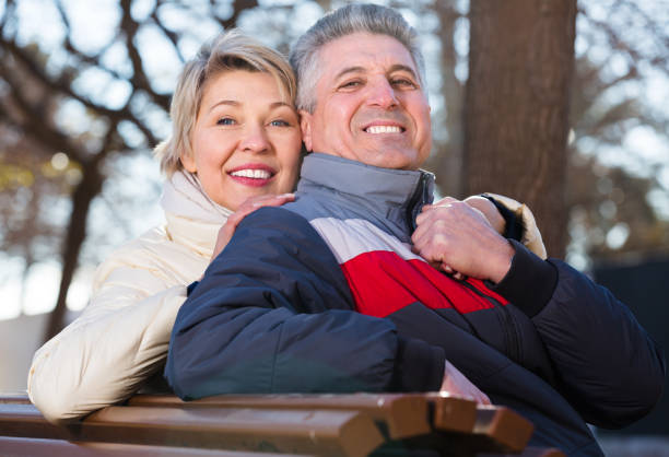 istock Mature couple on park bench 821865264
