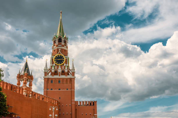 The Moscow Kremlin with the Spasskaya tower in the Red Square, Russia. The Moscow Kremlin is the residence of the Russian president and the main tourist attraction of Moscow.