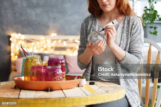 Woman Painting Jar At Home Stock Photo - Download Image Now - Jar, Painting - Activity, Recycling