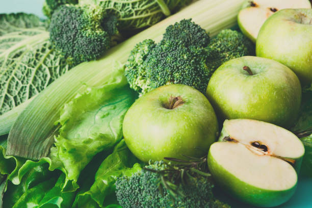 istock Flat lay of green vegetables on bright background 821872692