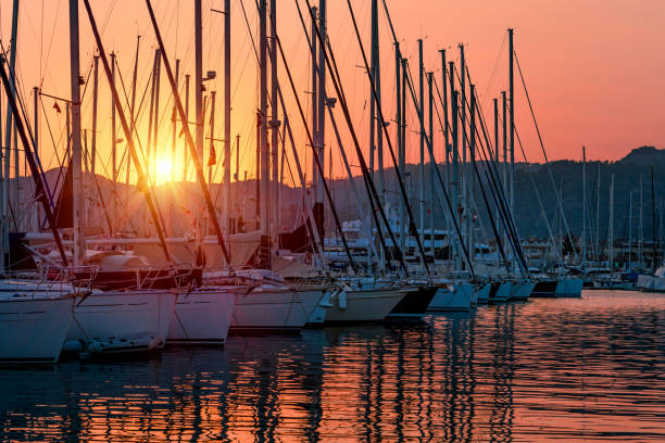 istock Sailboats in the harbor in mild sunset light 821877840