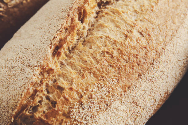 istock Bread texture background, closeup of baguette loaf 821884778