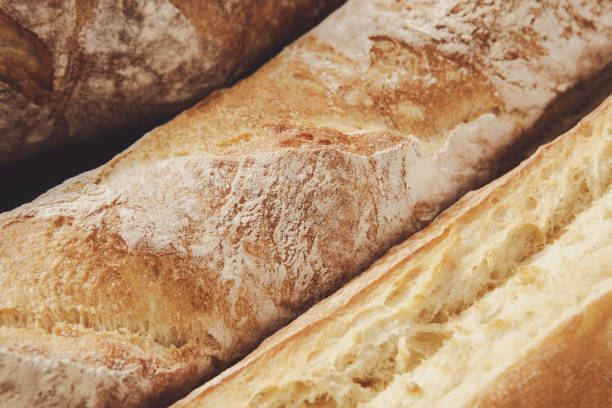 istock Bread texture background, closeup of baguette loaf 821884838