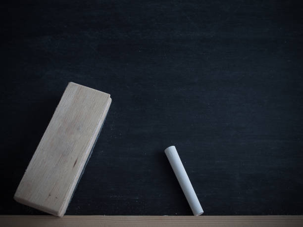istock Chalk rubbed out  and brush delete board on blackboard background. 821885508