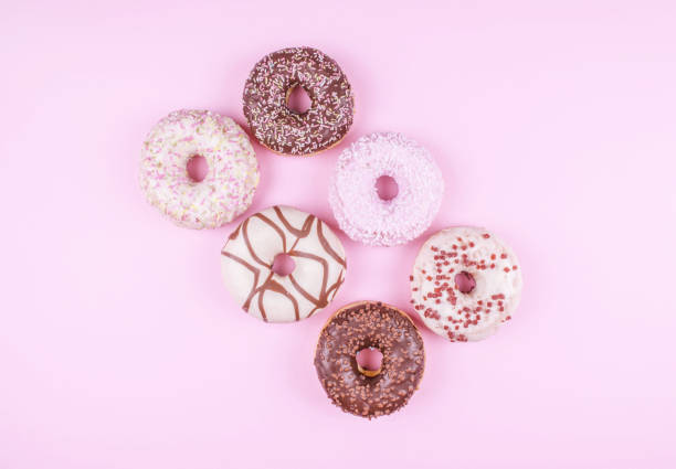istock Colorful donuts on pink background. 821887934