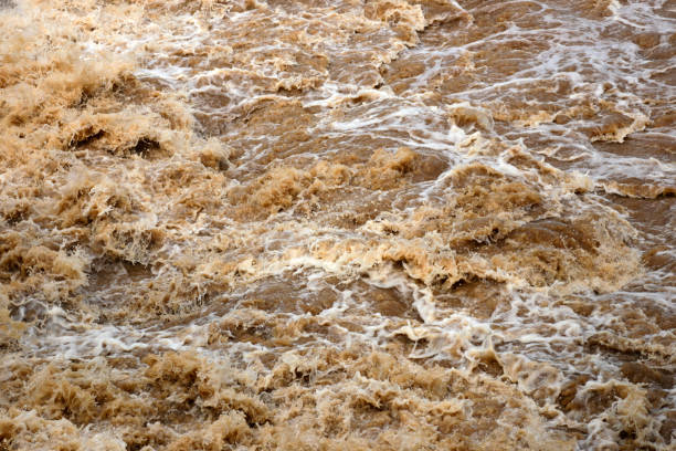 istock Red turbid water flows down from the mountain due to torrential rain. 821888434