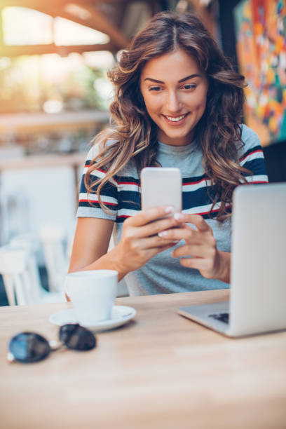 istock Girl texting in cafe 821889368