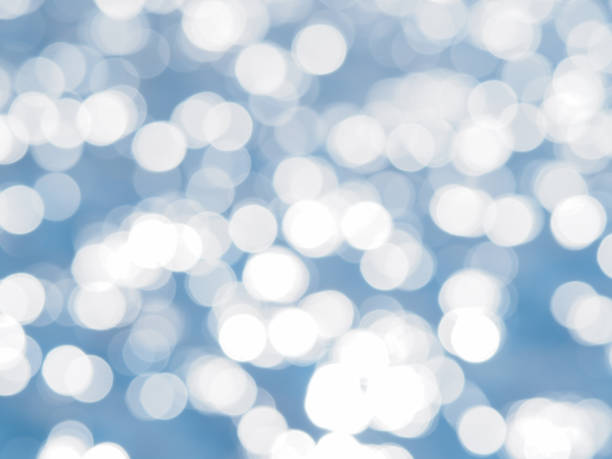 istock Blue bokeh abstract light background. Blurred Lights on blue background. Filtered color. 821893986