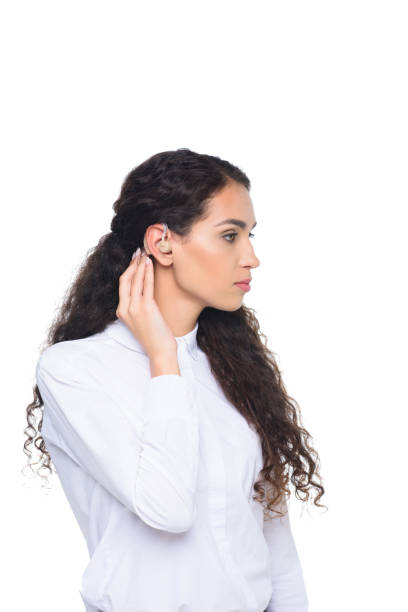 istock serious attractive brunette woman with hearing aid, isolated on white 821900074