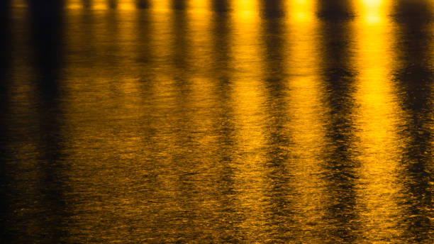 istock Yellow abstract background. Gold light abstract background. Yellow light reflect on water background. 821903496