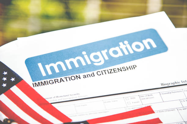 istock American immigration, citizenship forms with USA flag. 821903578
