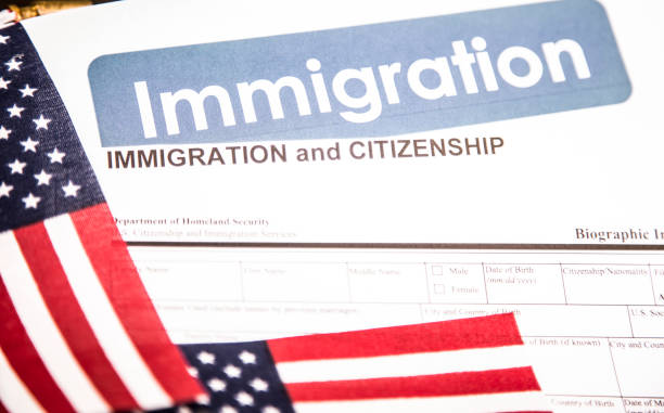istock American immigration, citizenship forms with USA flag. 821903838