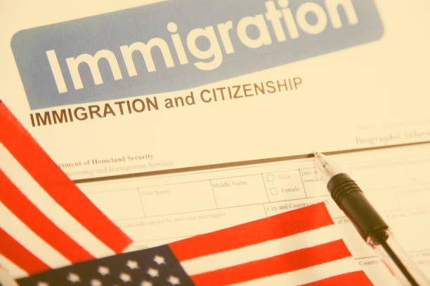 istock American immigration, citizenship forms with USA flag. 821904244