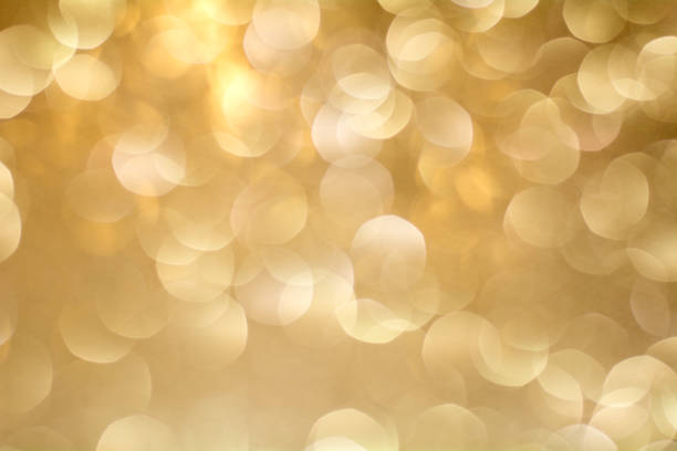 istock Gold Bokeh Background. The background with boke. Abstract texture. Color circles. Blurred. 821917894