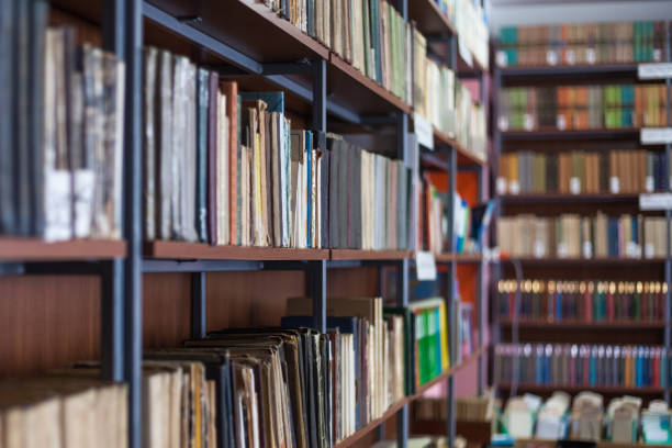 istock Bookshelf in library with many old books 821918672