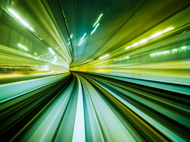 istock Motion blur train moving in city rail tunnel. 821918942