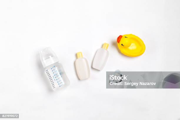 Baby Accessories For Bath With Duck On White Background Top View Stock Photo - Download Image Now