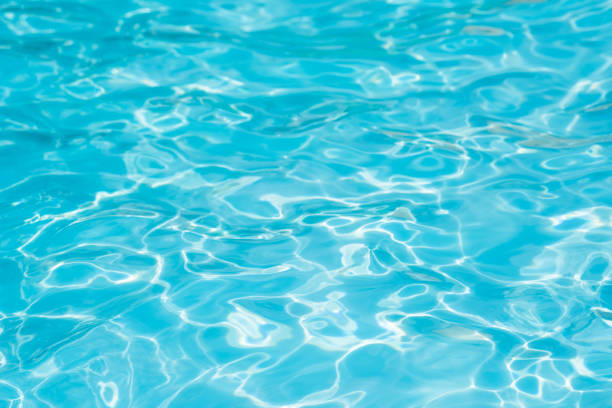 istock Beautiful ripple wave and blue water surface in swimming pool 821920298