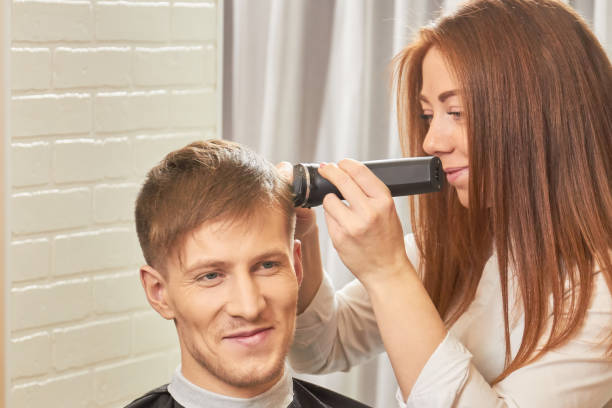 istock Smiling man at the barber. 821922858