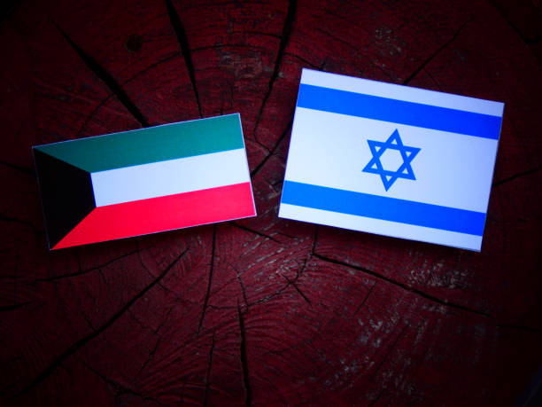 istock Kuwaiti flag with Israeli flag on a tree stump isolated 821926658