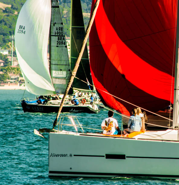 Opening of Ilhabela Sailing week when the parade of sailboats happens in front of the píer da vila in Ilhabela, Brazil stock photo