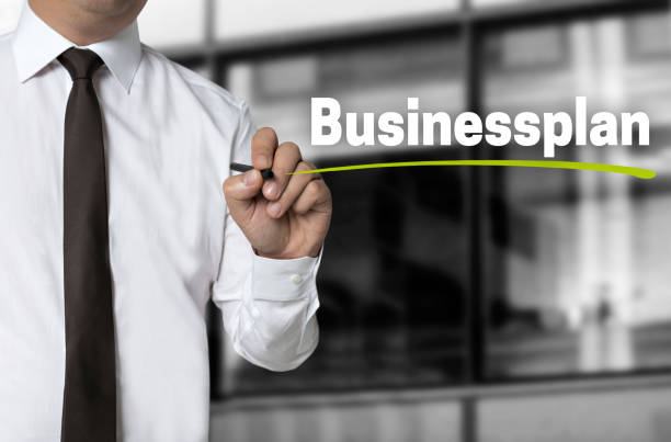 Business Plan is written by businessman background concept Business Plan is written by businessman background concept. how to write a business plan stock pictures, royalty-free photos & images