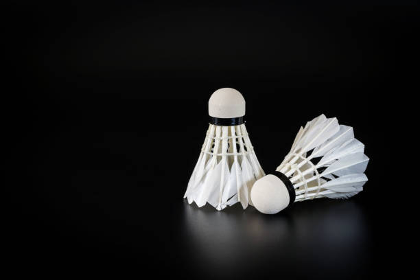 istock Badminton balls over black background 821927456