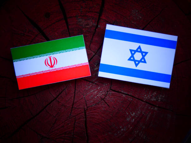 istock Iranian flag with Israeli flag on a tree stump isolated 821937404