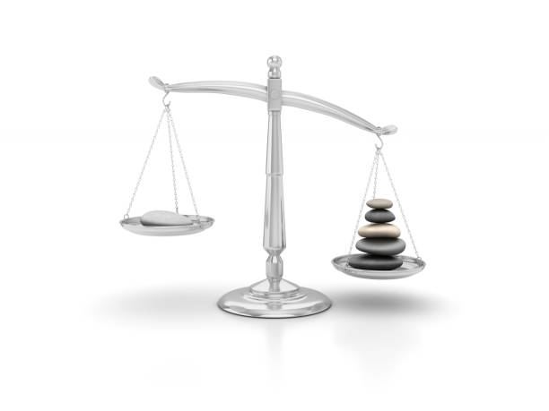 istock Pebbles on Scales of Justice - 3D Rendering 821940976
