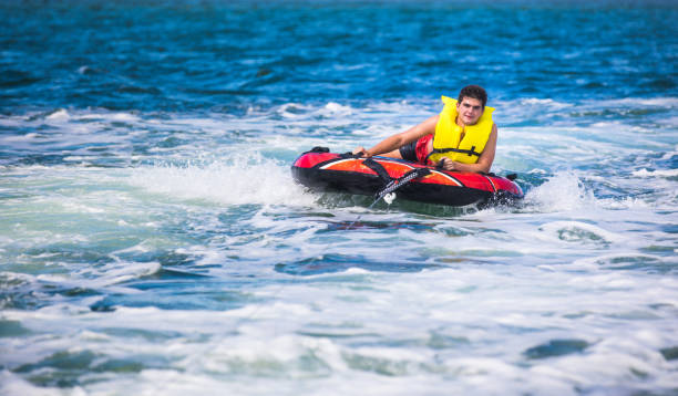 istock Tubing behind boat 821941548