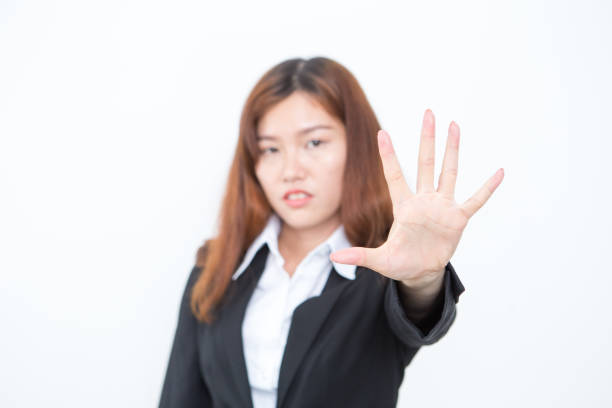 istock Serious Asian Business Woman Making Stop Gesture 821941662