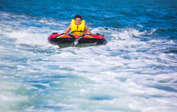 istock Tubing behind boat 821941740
