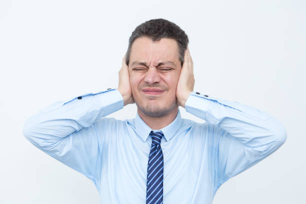 istock Tensed Middle-aged Business Man Covering Ears 821941810