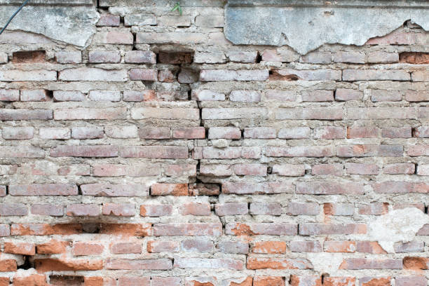istock cracked concrete vintage brick wall background 821945706