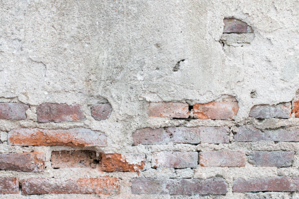 istock cracked concrete vintage brick wall background 821945894