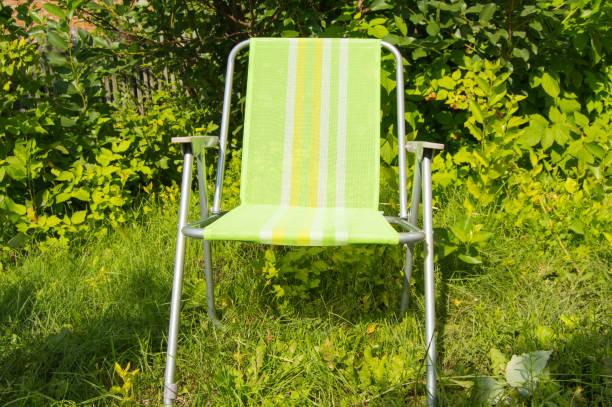Empty deck chair on the grass