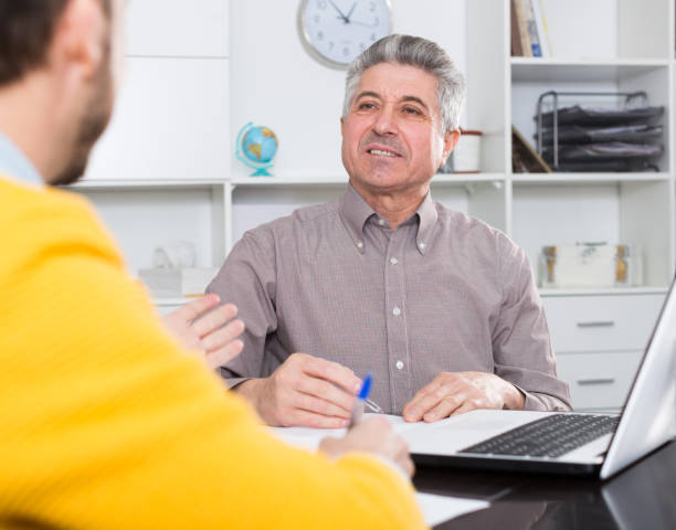 istock Men sign credit agreement 821949112