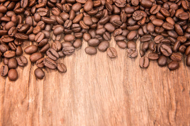 Coffee beans on grunge wooden background stock photo
