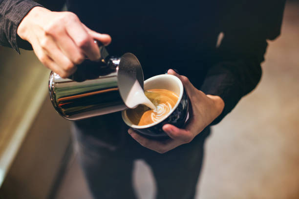 Barista make coffee cup latte art stock photo