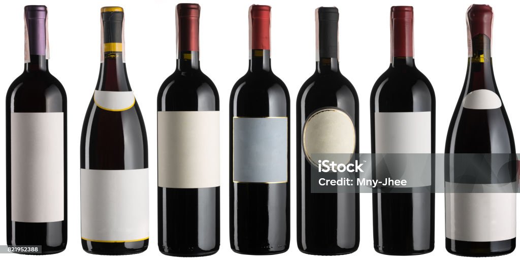 Set of multiple red wine bottles isolated on white Wine Bottle Stock Photo