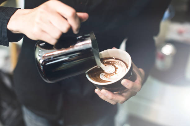 Barista make coffee cup latte art stock photo