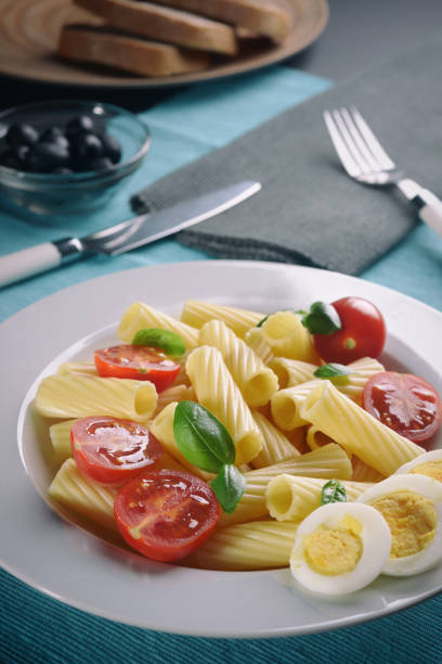 Italian pasta with tomatoes and eggs. Serving.